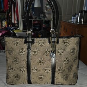 Doonev & Bourke signature logo tote bag with black leather trim and top handles